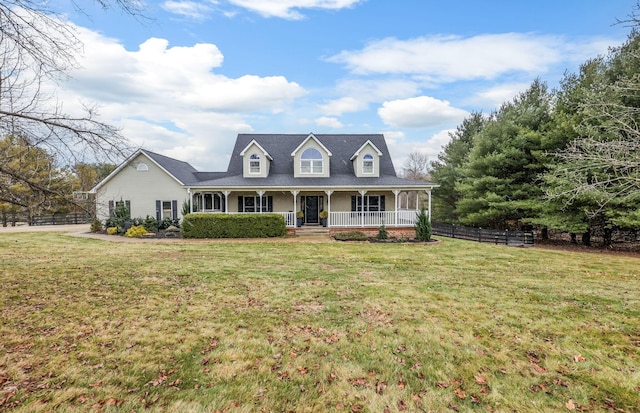 view of front of property featuring covered porch and a front lawn