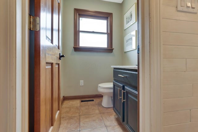 bathroom with tile patterned floors, vanity, and toilet