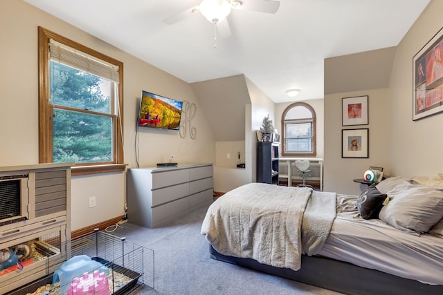 carpeted bedroom featuring ceiling fan and lofted ceiling