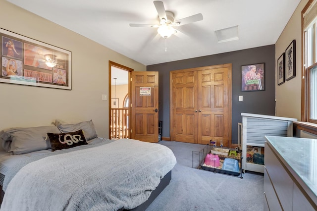 bedroom with ceiling fan, a closet, and carpet