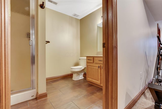 bathroom with vanity, toilet, and walk in shower