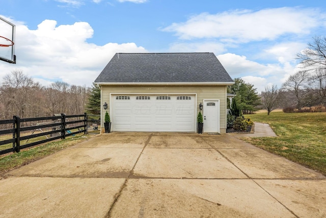 garage featuring a yard