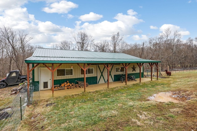 view of outbuilding with a yard