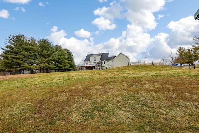 view of yard with a rural view