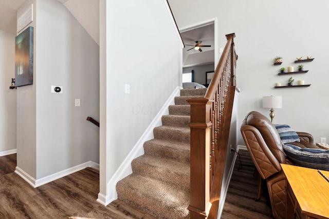 stairs with wood finished floors and baseboards