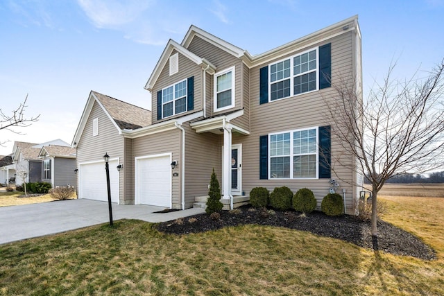 traditional home featuring a garage, concrete driveway, and a front lawn