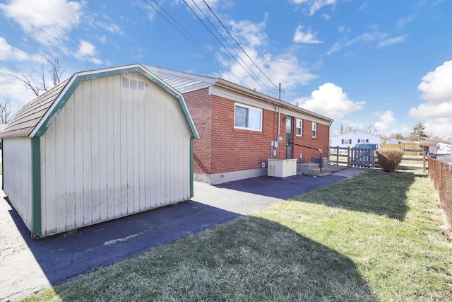 rear view of property featuring a yard