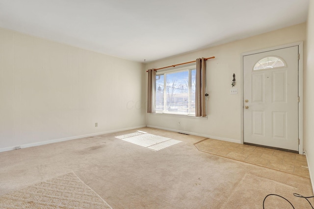 entrance foyer with light colored carpet