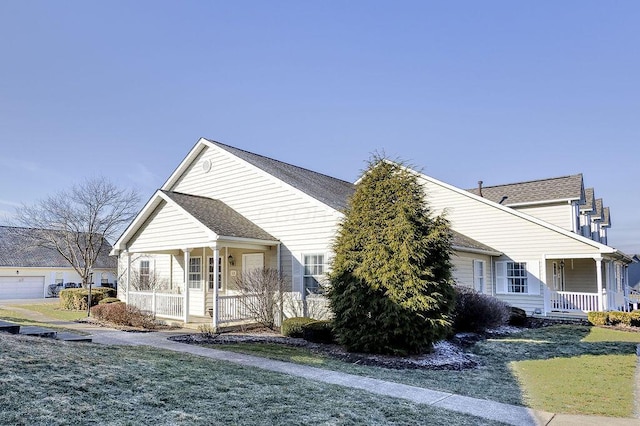 view of front of property with a porch and a front yard