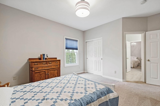 bedroom featuring light colored carpet and a closet