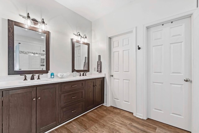 bathroom with vanity and hardwood / wood-style floors