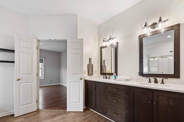 bathroom with vanity, hardwood / wood-style floors, and walk in shower