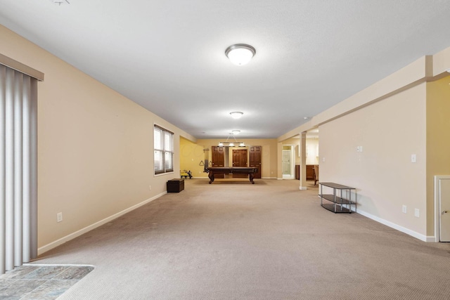 interior space with a notable chandelier, carpet floors, and billiards