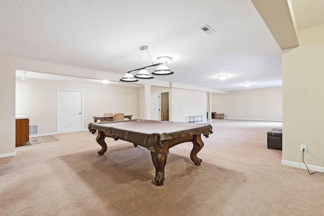 recreation room with pool table and light colored carpet