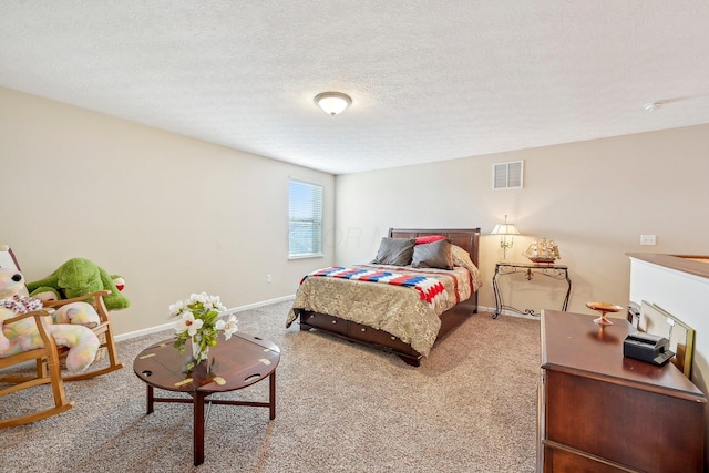 carpeted bedroom with a textured ceiling