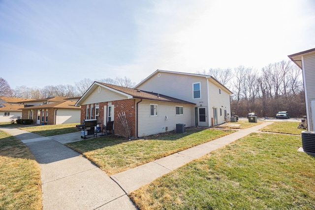 view of home's exterior featuring a garage and a lawn