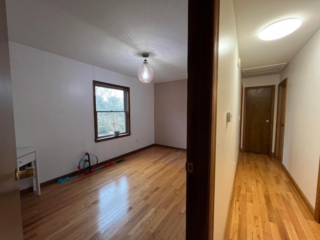 spare room with light hardwood / wood-style floors