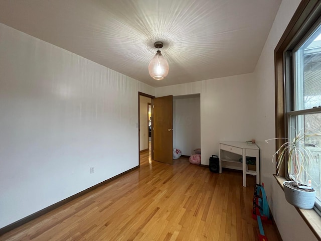 spare room with light wood-type flooring