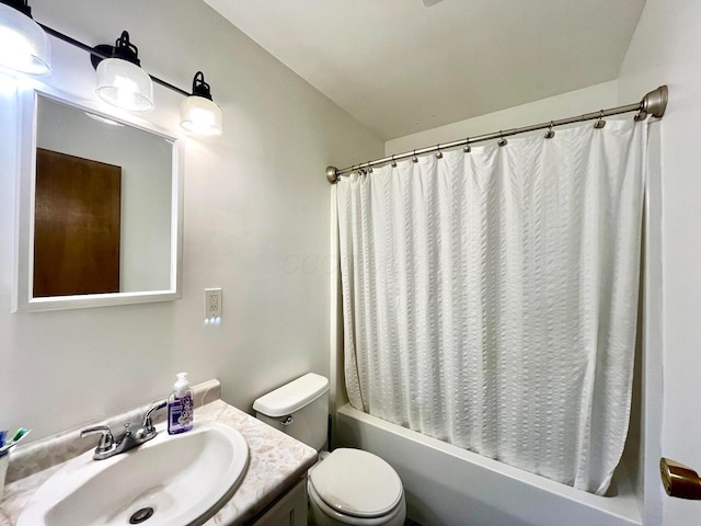 full bathroom with vanity, toilet, and shower / bath combo