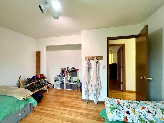 bedroom with light hardwood / wood-style flooring