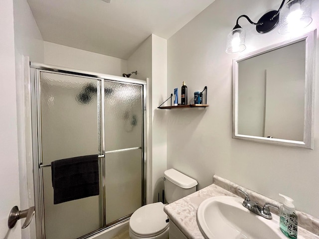 bathroom featuring walk in shower, vanity, and toilet