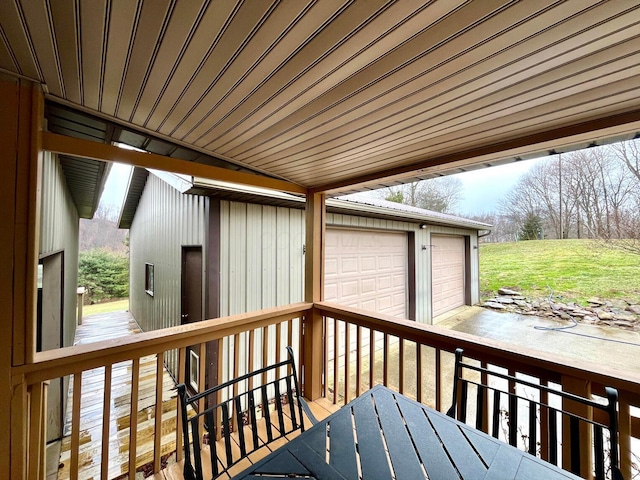 wooden terrace featuring a garage