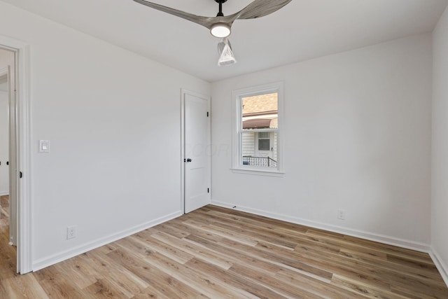 unfurnished room with light hardwood / wood-style flooring and ceiling fan