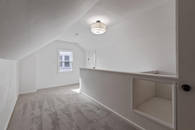 additional living space with lofted ceiling and carpet floors