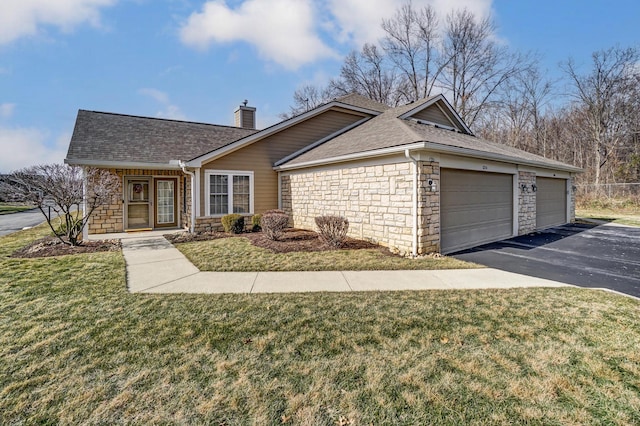 single story home featuring a garage and a front lawn