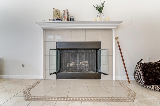 room details featuring a tile fireplace