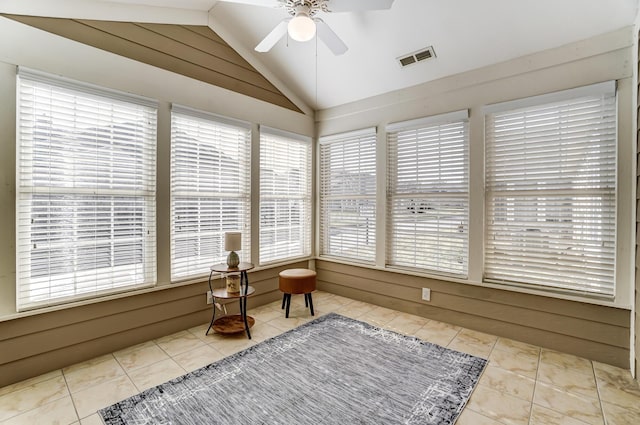 sunroom / solarium with ceiling fan and vaulted ceiling