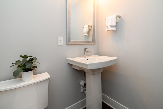 bathroom with toilet and sink