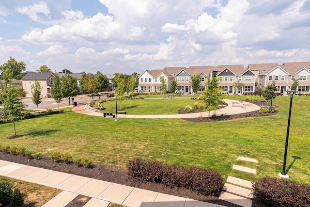 view of property's community with a yard