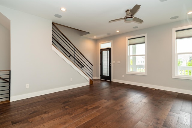 foyer with dark wood-type flooring and ceiling fan