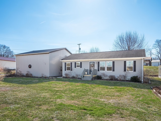 single story home with a front lawn