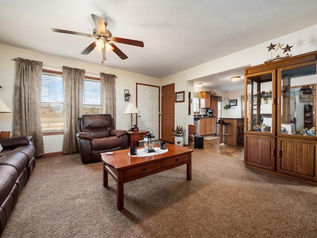 living room featuring ceiling fan and light carpet