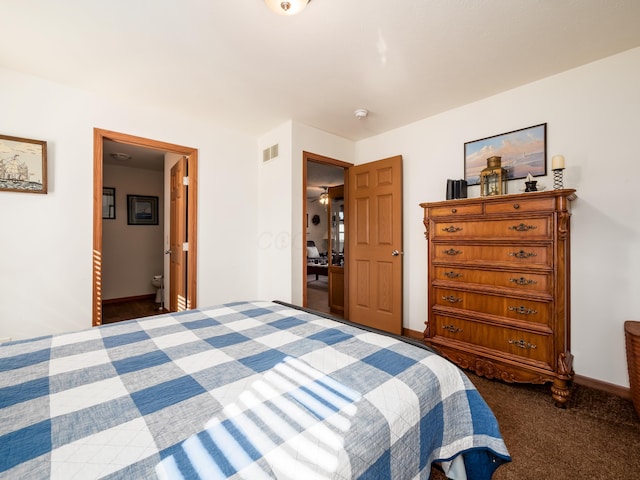 carpeted bedroom featuring ensuite bathroom