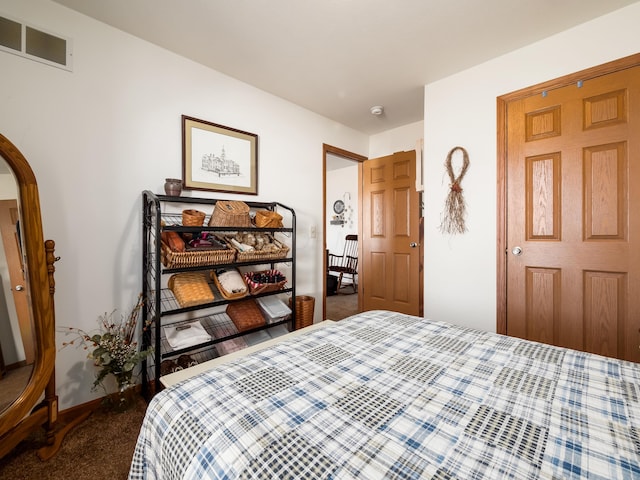 bedroom featuring dark colored carpet