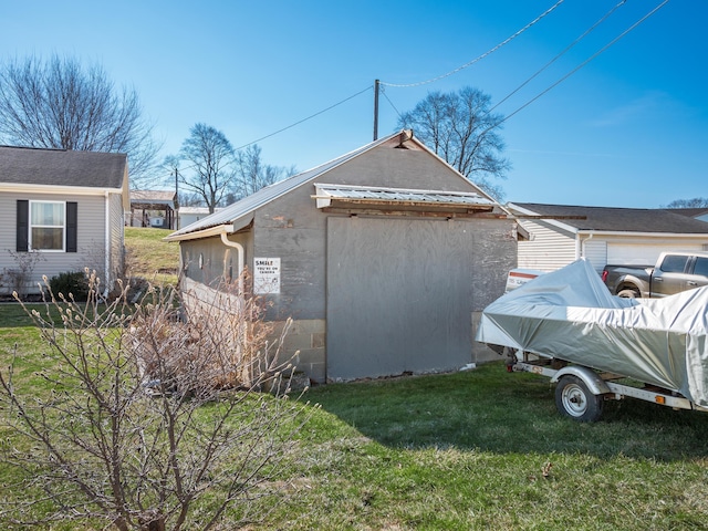 view of home's exterior with a yard