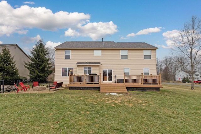 back of property featuring a lawn, an outdoor fire pit, cooling unit, a deck, and a patio