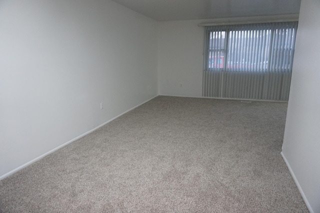 empty room featuring carpet flooring