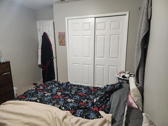 carpeted bedroom with a closet