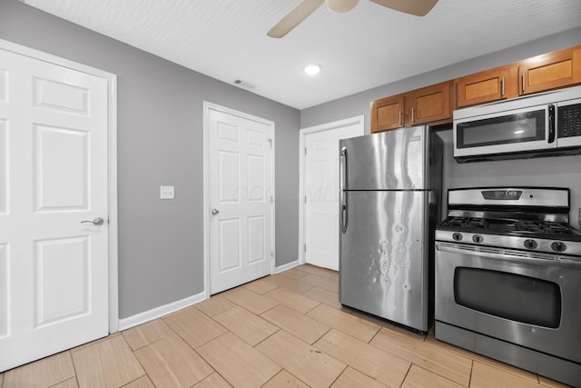 kitchen featuring stainless steel appliances and ceiling fan