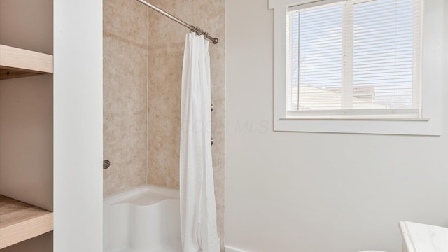 bathroom featuring a shower with curtain