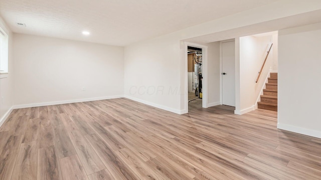 spare room with light hardwood / wood-style floors