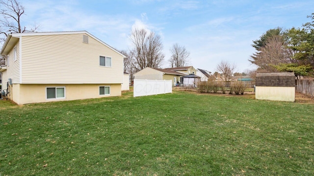 view of yard with a storage unit