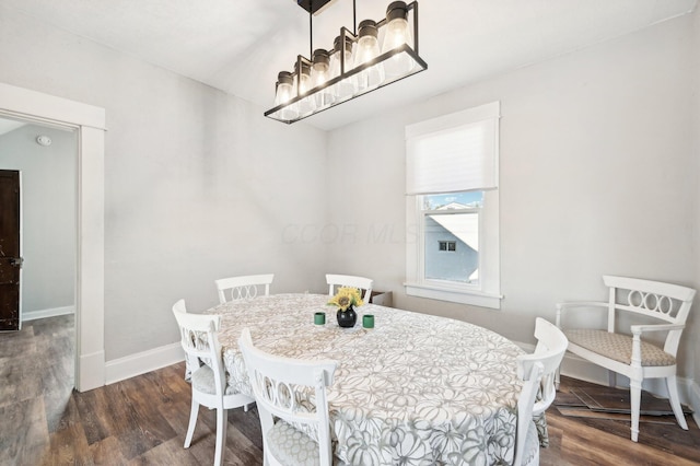 dining space featuring dark hardwood / wood-style flooring