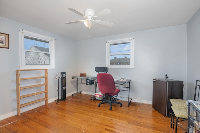 office with a ceiling fan, baseboards, and wood finished floors