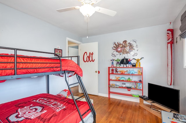 bedroom with ceiling fan and wood finished floors