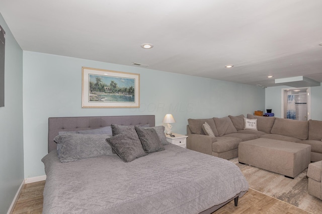 bedroom featuring recessed lighting, visible vents, baseboards, and wood finished floors